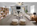Bright living room with fireplace, modern furnishings, and black and white striped rug at 5158 Summersun Dr, Morrow, GA 30260
