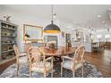 Elegant dining room featuring a round table, stylish chairs, and a decorative rug at 6838 Prelude Dr, Atlanta, GA 30328