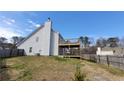 View of the two-story deck of this gray two-story home, with a fenced-in yard at 4271 Winston Cir, South Fulton, GA 30349