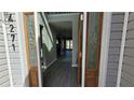 Open foyer with gray walls and wood-look flooring, seen through decorative glass doors at 4271 Winston Cir, South Fulton, GA 30349