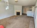 Inviting living room featuring a fireplace, neutral paint, and sliding doors to let in plenty of natural light at 6583 Arbor Gate Sw Dr # 10, Mableton, GA 30126