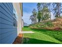 Spacious backyard featuring a concrete patio, perfect for outdoor entertaining at 650 Cayenne Way, Lawrenceville, GA 30045