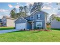 Charming two-story home with well-manicured lawn, attached garage, and inviting curb appeal at 650 Cayenne Way, Lawrenceville, GA 30045