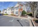 View of townhouse exterior, landscape, and parking, with accessible parking for those with disabilities at 1710 Kilmington Ct, Alpharetta, GA 30009