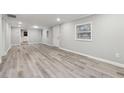 Bright living room with neutral paint, new wood floors, white trim and lots of natural light at 555 N Lake N Dr, Covington, GA 30016