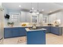 Stylish kitchen featuring custom blue and white cabinetry and a center island at 648 Cooledge Ave, Atlanta, GA 30306