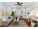 Bright living room with hardwood floors, a large window, and stylish decor at 648 Cooledge Ave, Atlanta, GA 30306