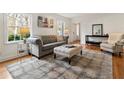 Bright living room with hardwood floors, modern furnishings, and lots of natural light at 124 The Prado, Atlanta, GA 30309