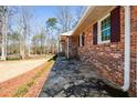 Charming brick house with stone pathway and manicured lawn at 4205 S Hurt Sw Rd, Smyrna, GA 30082