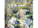 An aerial view showcases the .96 acre lot of this charming property with mature trees at 2953 Hardman Ne Ct, Atlanta, GA 30305