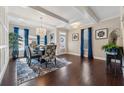 Spacious dining room features hardwood floors, modern lighting, and a large window at 4727 Tiger Blvd, Duluth, GA 30096