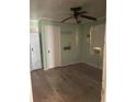 Cozy bedroom with vintage ceiling fan, wood paneling, and a window unit air conditioner at 982 Scott Cir, Decatur, GA 30033