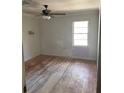 Bedroom featuring hardwood floors, a ceiling fan, and natural light through the window at 982 Scott Cir, Decatur, GA 30033