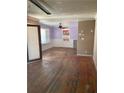 Open living room featuring hardwood floors, ceiling fan, and large window for natural light at 982 Scott Cir, Decatur, GA 30033
