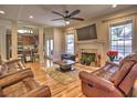 Cozy living room with hardwood floors, fireplace, and open access to the kitchen at 1326 Nantahala Ne Trl, Marietta, GA 30062