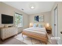 Cozy bedroom featuring a comfortable bed, nightstands, dresser and soft lighting at 242 Meadow Spring Dr, Temple, GA 30179