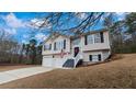 Charming two-story home with a two-car garage and well-maintained front yard at 266 Carthage Blvd, Rockmart, GA 30153