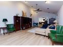 Spacious living room with vaulted ceiling, wood flooring, and ample natural light at 106 Lanyard Bnd, Peachtree City, GA 30269