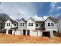 New two-story homes with modern facades and individual garages at 11598 E Lovejoy Rd, Hampton, GA 30228