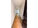 Bright, long hallway with white walls and a view into another room, newly built at 11602 E Lovejoy Rd, Hampton, GA 30228