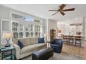 Inviting living room with large windows, shutters, modern decor, and hardwood floors at 424 Lindbergh Ne Dr # 201, Atlanta, GA 30305