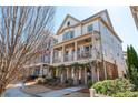 Charming home featuring a covered front porch, brick accents, and manicured landscaping at 219 Dawson Dr, Woodstock, GA 30188