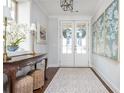 Elegant foyer featuring hardwood floors, stylish decor, and abundant natural light at 219 Dawson Dr, Woodstock, GA 30188