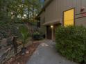 Inviting condo exterior with a well-manicured walkway leading to the front entrance and green foliage at 2707 Cumberland Se Ct, Smyrna, GA 30080