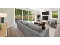 Cozy living room featuring a fireplace, modern furnishings, and a large sliding door to the backyard at 622 Bellemeade Nw Ave # 4, Atlanta, GA 30318
