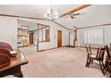 Spacious living room featuring a chandelier, ceiling fan, and decorative wood trim at 1184 Alemeda Dr, Marietta, GA 30066