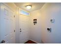 Bright entryway with a white front door and hardwood floors at 1315 Mcgill Park Ne Ave, Atlanta, GA 30312