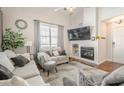 Cozy living room with fireplace, TV, neutral colors, and comfortable seating at 251 Manley Ct, Woodstock, GA 30188