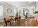 Open dining room with hardwood floors, modern lighting and decor at 4309 Elliott Way, Smyrna, GA 30082