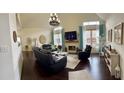 Bright living room with hardwood floors, fireplace, vaulted ceilings, and large windows at 60 Saddle Tree Way, Sugar Hill, GA 30518
