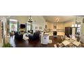 Open floor plan showcasing the living room, kitchen, and dining area at 60 Saddle Tree Way, Sugar Hill, GA 30518