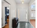 Bright entryway featuring neutral walls, stylish tile flooring, and convenient storage unit at 840 Cline Petty Way Way, Lawrenceville, GA 30043