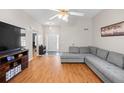 Spacious living room featuring hardwood floors, ample seating, and a view of the entryway at 840 Cline Petty Way Way, Lawrenceville, GA 30043