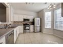 Bright and airy kitchen featuring stainless steel appliances and tile floors for easy maintenance at 107 Timber Ridge Dr, Cartersville, GA 30121