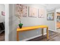 Contemporary hall table styled with modern art and floral arrangements, great flooring at 130 26Th Nw St # 615, Atlanta, GA 30309