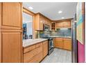 Updated kitchen with granite countertops, stainless steel appliances, and wood cabinetry at 130 26Th Nw St # 615, Atlanta, GA 30309
