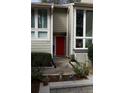 Inviting front entrance with well maintained landscaping and a vibrant red front door at 1932 Variations Ne Dr, Atlanta, GA 30329