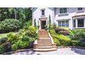 Beautiful stone stairway leading to the front entrance, surrounded by lovely landscaping at 1165 E Beechwood Nw Dr, Atlanta, GA 30327