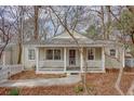 Charming single-story home with a welcoming front porch and well-maintained landscaping at 148 Murray Hill Ne Ave, Atlanta, GA 30317