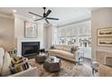 Cozy living room with fireplace, neutral palette, stylish decor, and large windows at 3715 Peachtree Ne Rd # 2, Atlanta, GA 30319