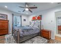 Cozy bedroom with a ceiling fan, natural light, and hardwood floors at 1901 Cumberland Ct, Smyrna, GA 30080