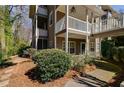 Multi-level exterior view showcasing multiple decks and mature landscaping around the property at 2135 N Forest Trl, Dunwoody, GA 30338