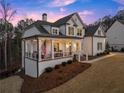 Desirable home with an inviting front porch, showcasing outdoor living and curb appeal at 6455 Quiet Cove Rd, Cumming, GA 30041
