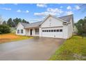 Attractive one-story home with a garage and black trimmed windows at 331 Cobblestone Rd, Auburn, GA 30011