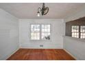 Cozy dining area with hardwood floors and a view of the outdoors through a large window at 160 Pine Grove Dr, Canton, GA 30114