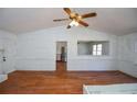 Bright living room featuring hardwood floors, a ceiling fan, and pass through to kitchen at 160 Pine Grove Dr, Canton, GA 30114